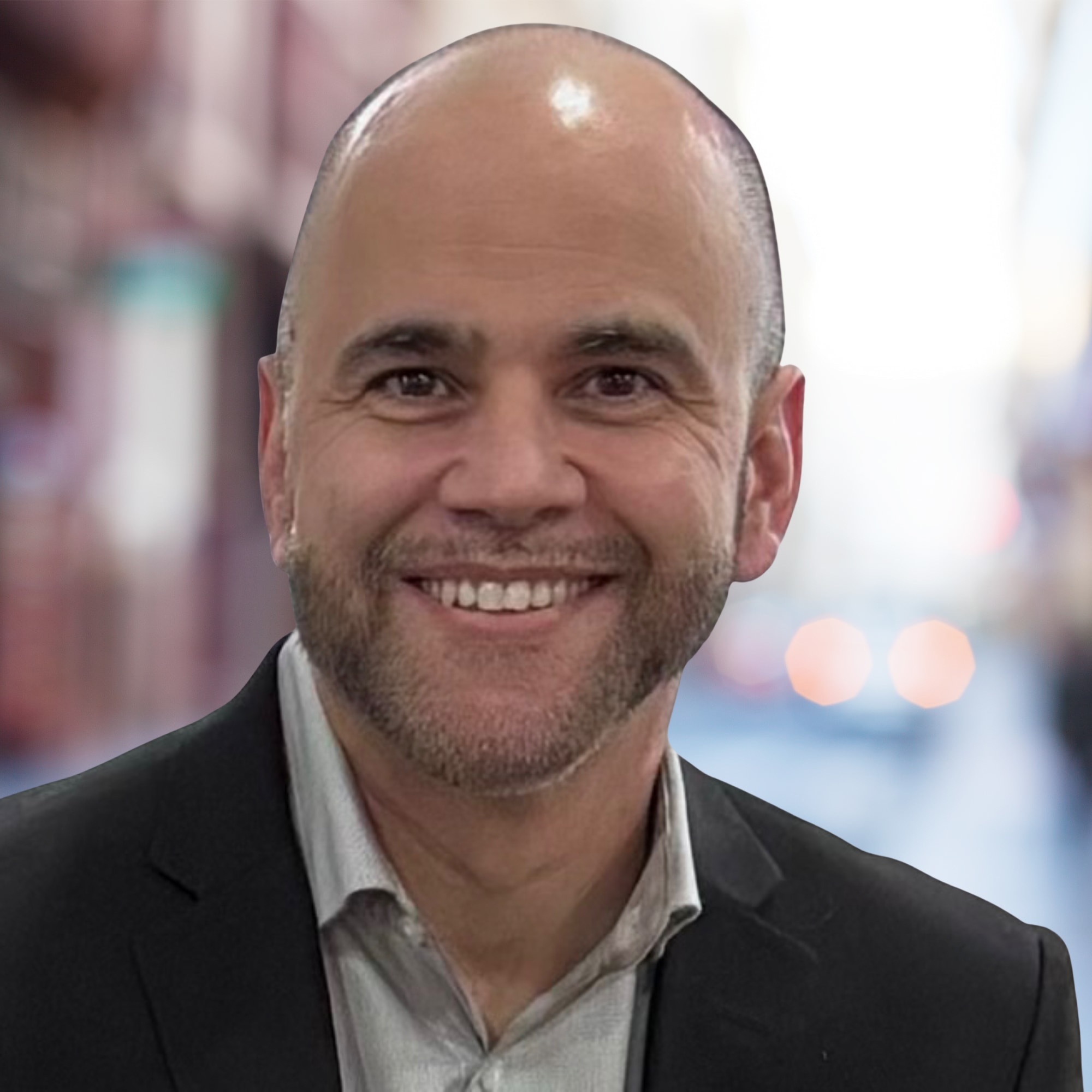 Smiling man in suit on street background